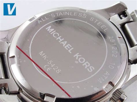 back of real and fake michael kors watch|genuine michael kors watch.